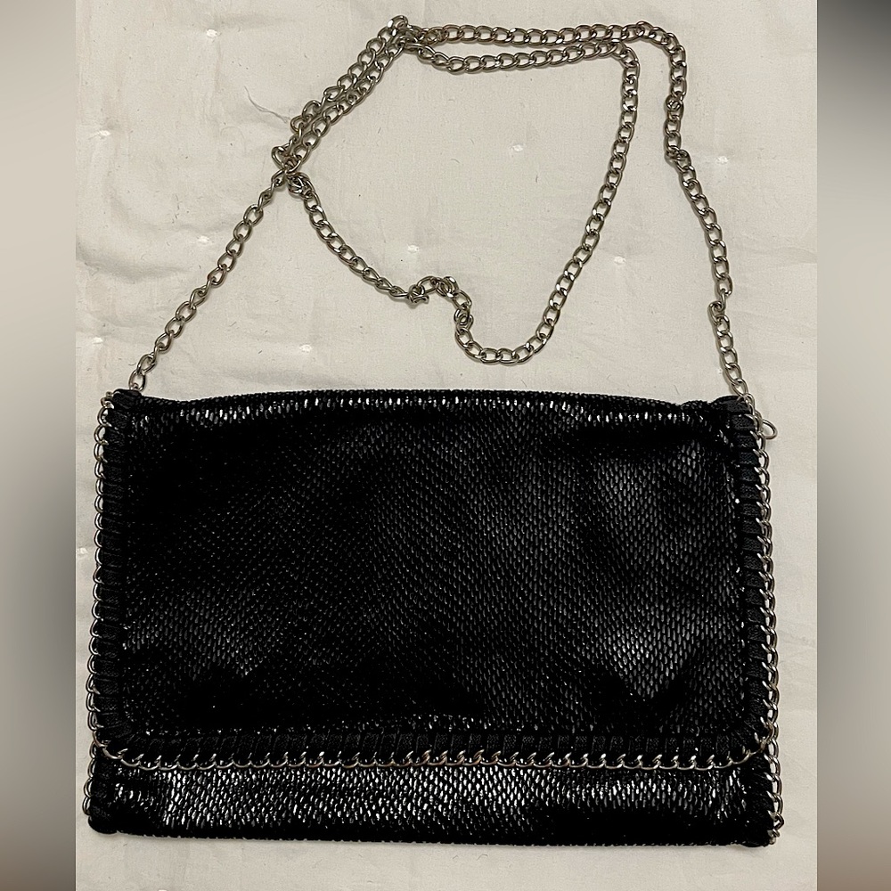 Snakeskin clutch with silver hardware, removable strap, snap closure